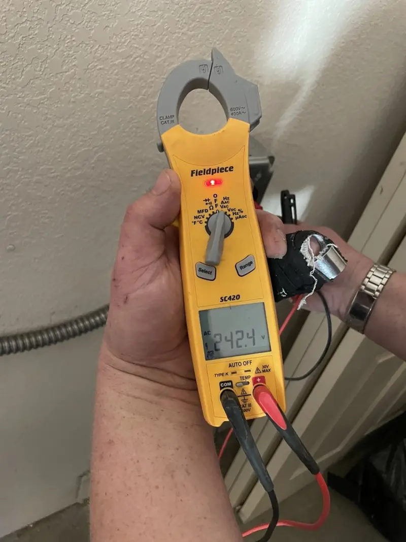 Voltage testing with clamp meter during Electrical Installation Services in Indian Head